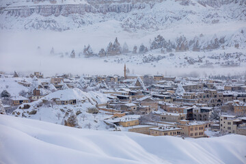 Pigeon Valley and Cave town in Goreme during winter time. Cappadocia, Turkey. Open air museum, Goreme national park. Heavenly landscape