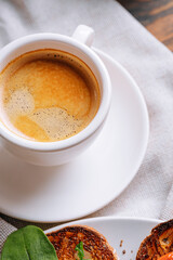 hearty and high-calorie breakfast. delicious and mouth-watering bruschetta with fried eggs and herbs for breakfast with a cup of aromatic coffee.