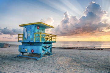Art Deco Lifeguard Station on 2nd Street at Miami Beach During a Colorful Sunrise with Clouds in...