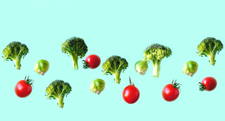 Creative vegetable background with flying cabbage and tomato on green background. The concept of healthy diet. 