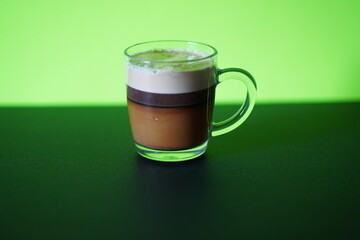 Delicious fresh made Latte in a glass cup