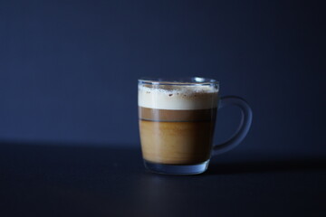 Delicious fresh made Latte in a glass cup