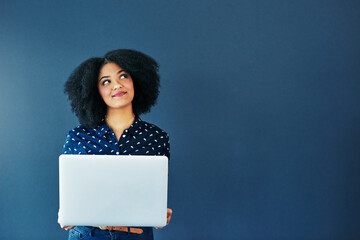 Social media never fails to tickle the mind. Studio shot of an attractive young woman looking...
