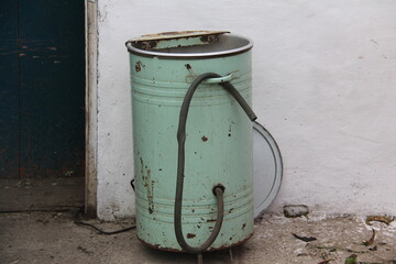 Old vintage light green with a rubber hose home washing machine produced in the second half of the...