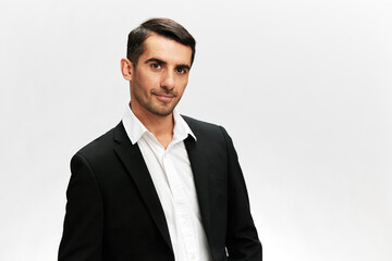 handsome businessman in a modern suit emotion self-confidence official light background