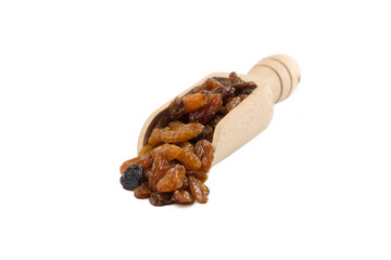  royal raisins in wooden scoop isolated on white background. Spice and food ingredients.