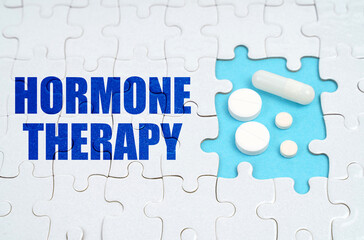On the puzzles there is an inscription - Hormone Therapy, on a blue background pills.