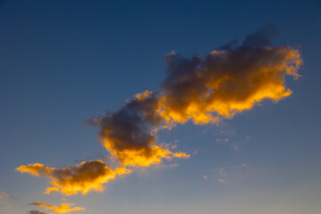 Clouds at sunset. Orange clouds at sunset or sunrise with clear sky