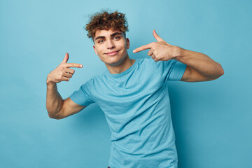 handsome guy in blue t-shirts with a pumped-up body unaltered