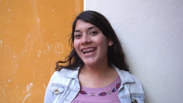 Latina Woman With Light Brown Skin And Long Hair Smiling