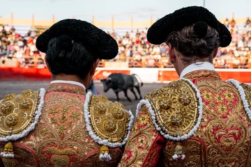  bullfighter on his back looking at the bull © Emmanuel