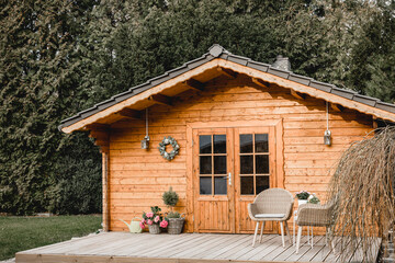 Small cottage in the countryside. Garden house made of wood. Cottage in your own garden for hobbies...