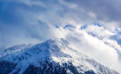 Mountain peaks covered with snow during winter time in Tirol, Austria.