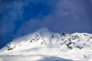 Mountain peaks covered with snow during winter time in Tirol, Austria.