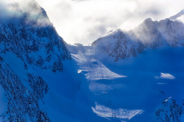Mountain peaks covered with snow during winter time in Tirol, Austria.