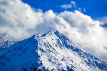 Fototapeta na wymiar Mountain peaks covered with snow during winter time in Tirol, Austria.