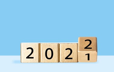 woodblocks cubes with a number 2021 change to 2022 . new year 2021- 2022 concept.