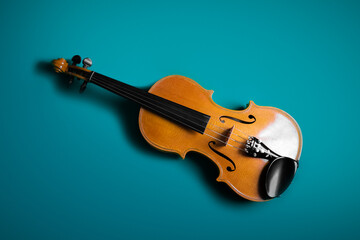 The front of a violin. Isolated by a blue background.