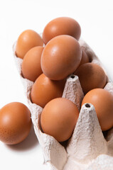 Eggs brown together on white background vertical