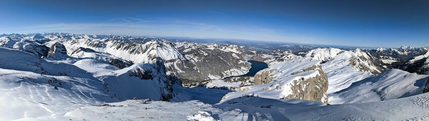 Fototapeta na wymiar Beautiful mountain panorama from the mutteristock summit to the wagitalersee in the canton of Schwyz. Ski mountaineering
