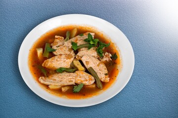 Tasty noodle soup with vegetables in bowl on the desk