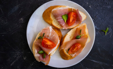 delicious sandwich with jamon, tomato