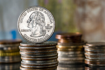 Inflation Interest Rates Quarter Dollar on top of Pile of Coins