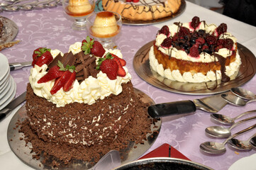 sweet cakes of many tastes for birthdays, weddings and festive events with flowers and decorations of chocolate meringue vanilla and different flavors