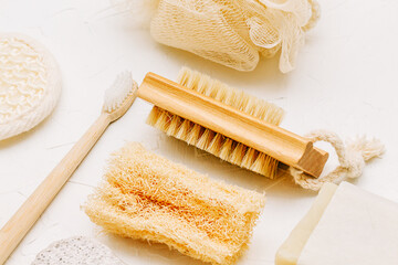 Zero waste concept, sustainable lifestyle. plastic free natural eco bamboo toothbrush,  soap,, luffa, brush. Bath accessories made of natural material