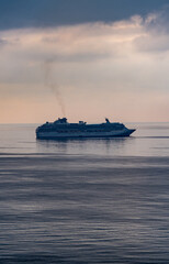 Fototapeta na wymiar Cruise ship sails through the Mediterranean Sea, Malaga. Sea vacation concept