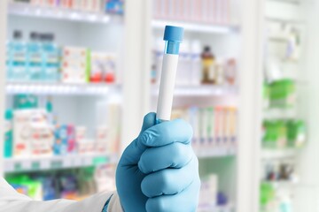 Medical laboratory assistant holding tube, Omicron COVID-19 concept