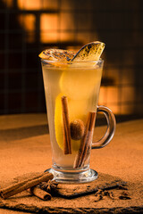 Delicious hot winter drink in glass mug spicy tea
