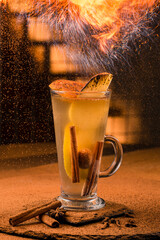 Delicious hot winter drink in glass mug spicy tea