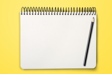 Blank 2022 desk calendar on yellow background.