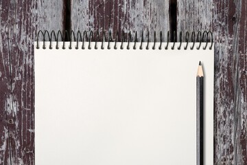 Blank 2022 desk calendar on wooden background.