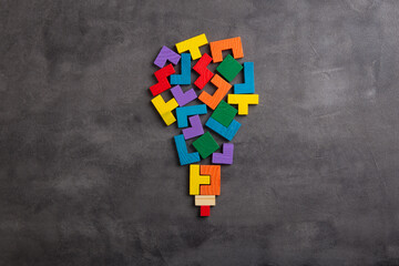 Creative idea and solve the problem concept. Teamwork success strategy - wooden jigsaw on the grey background