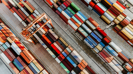 Aerial view of shipping container port terminal. Colourful pattern of containers in harbor. Maritime logistics global inport export trade transportation. - obrazy, fototapety, plakaty