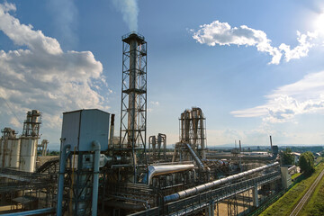 Aerial view of oil and gas refining petrochemical factory with tall refinery plant manufacture structure