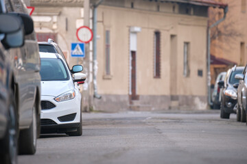 City traffic with cars parked in line on street side