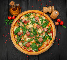 Tasty hot italian pizza on black wooden table.
