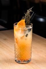 Homemade refreshing summer lemonade cocktail with orange juice, crushed ice, rosemary and citrus fruits. Summer healthy drink