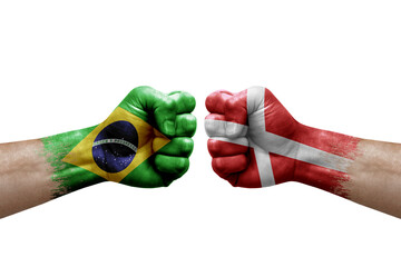 Two hands punch to each others on white background. Country flags painted fists, conflict crisis...