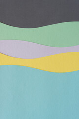 paper design with wavy lines and blank space in blue, yellow, mauve, green, and gray