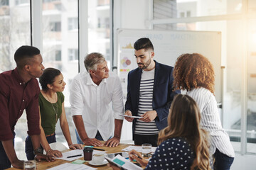 Together we can create something spectacular. Shot of creative employees working in a modern office.