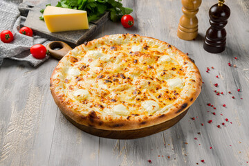 Cheese pizza on board on grey table