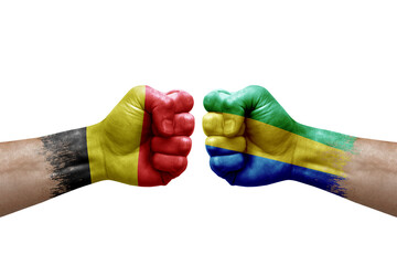 Two hands punch to each others on white background. Country flags painted fists, conflict crisis...