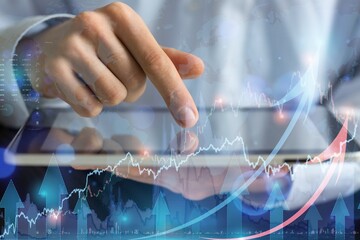 Businessman holding digital tablet 2022 stock market forecast outlook, charts and candlesticks