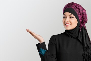 Happy beautiful muslim woman with hijab posing