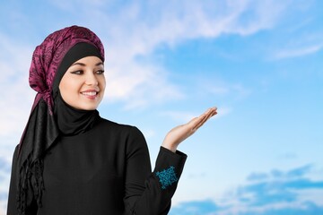Happy beautiful muslim woman with hijab posing