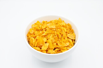 Corn Flakes, in a white bowl, isolated on a white background